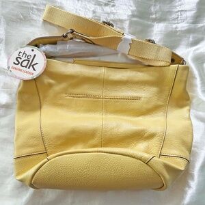 BUCKET BAG, LEATHER, YELLOW, TOP ZIPPER, ADJUSTABLE STRAP, POCKETS, by THE SAK,